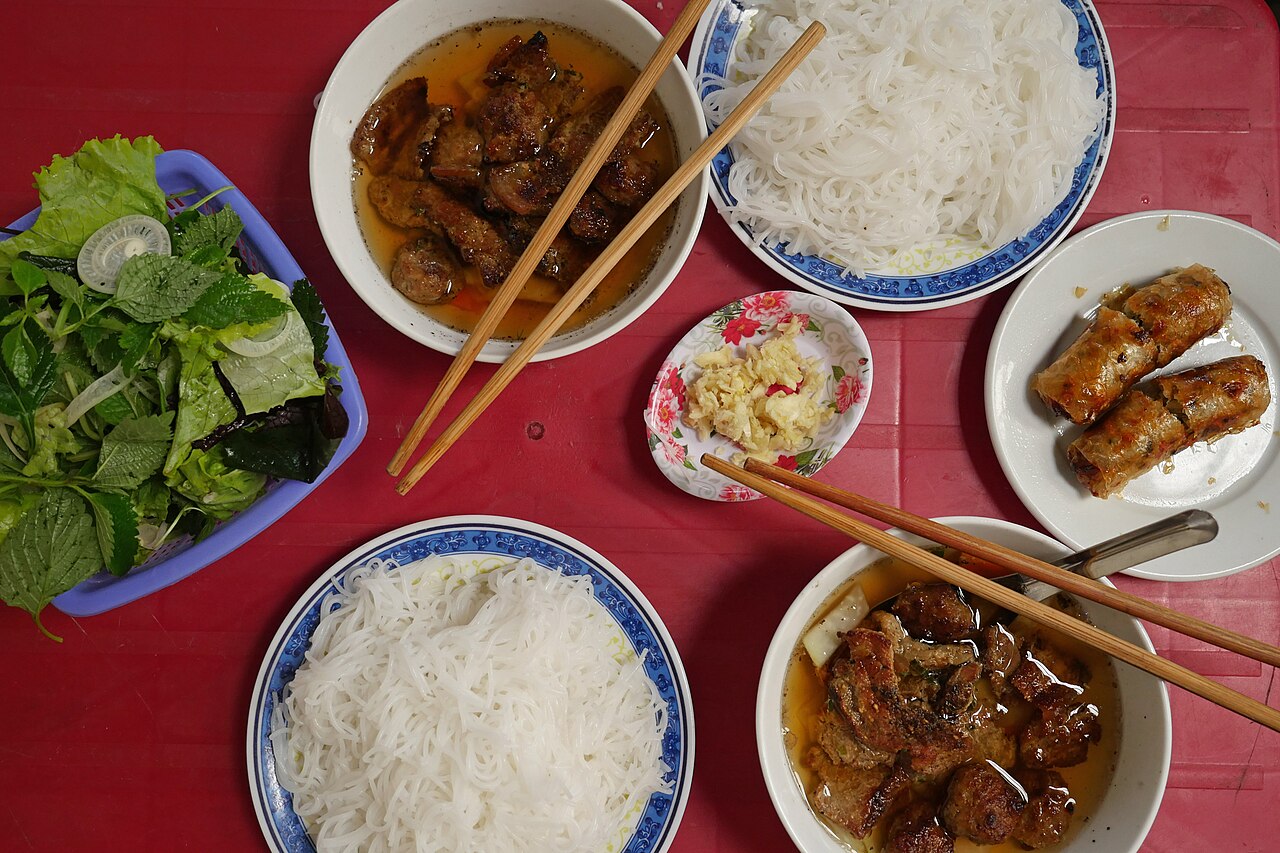 Bun cha, grilled pork with noodles and herbs, Hanoi's signature street dish (Wikimedia Commons)